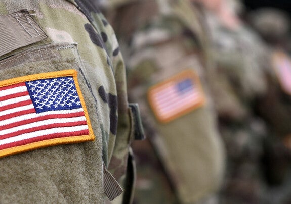 Close-up of American flag patch on military uniform