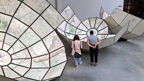 two people looking at an art installation