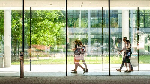 Students walking through hallways of Evans Hall